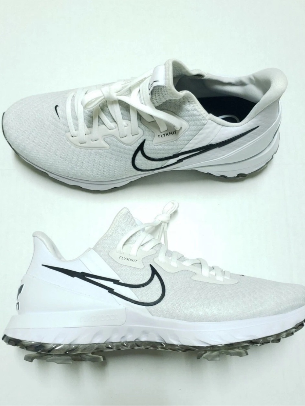 Nike White Flyknit Sneakers with Black Swoosh Accent